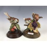 Two bird figurines