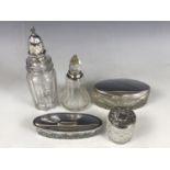Edwardian and later silver covered cut-glass containers, including an Edwardian caster, a silver-
