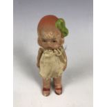 A 1920s porcelain doll, 9.5 cm