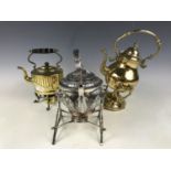 Two brass spirit kettles together with an electroplate spirit kettle