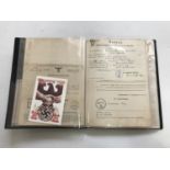 A ring binder containing a large quantity of assorted German Third Reich documents and ephemera