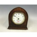 An oak cased mantel timepiece clock retailed by Seale of Lowestoft