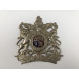 An early 20th Century enamelled white-metal Royal Arms badge / plate, 9 cm x 8 cm