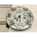 A late 19th / early 20th century enamelled wall clock, having a later quartz movement