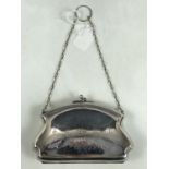 An Edwardian lady's electroplate purse with ring suspender, with bright-cut floral swags and an