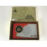 A Perido Piccadilly transistor radio in red, in original carton with instructions