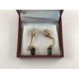 A contemporary pair of 9ct gold, white topaz and indicolite ear pendants, with certificate of