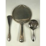 A George V silver hand mirror, having an engraved monogram, Chester, 1916, together with a silver-