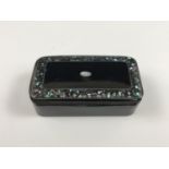 A 19th Century black lacquered and abalone inlaid snuff box