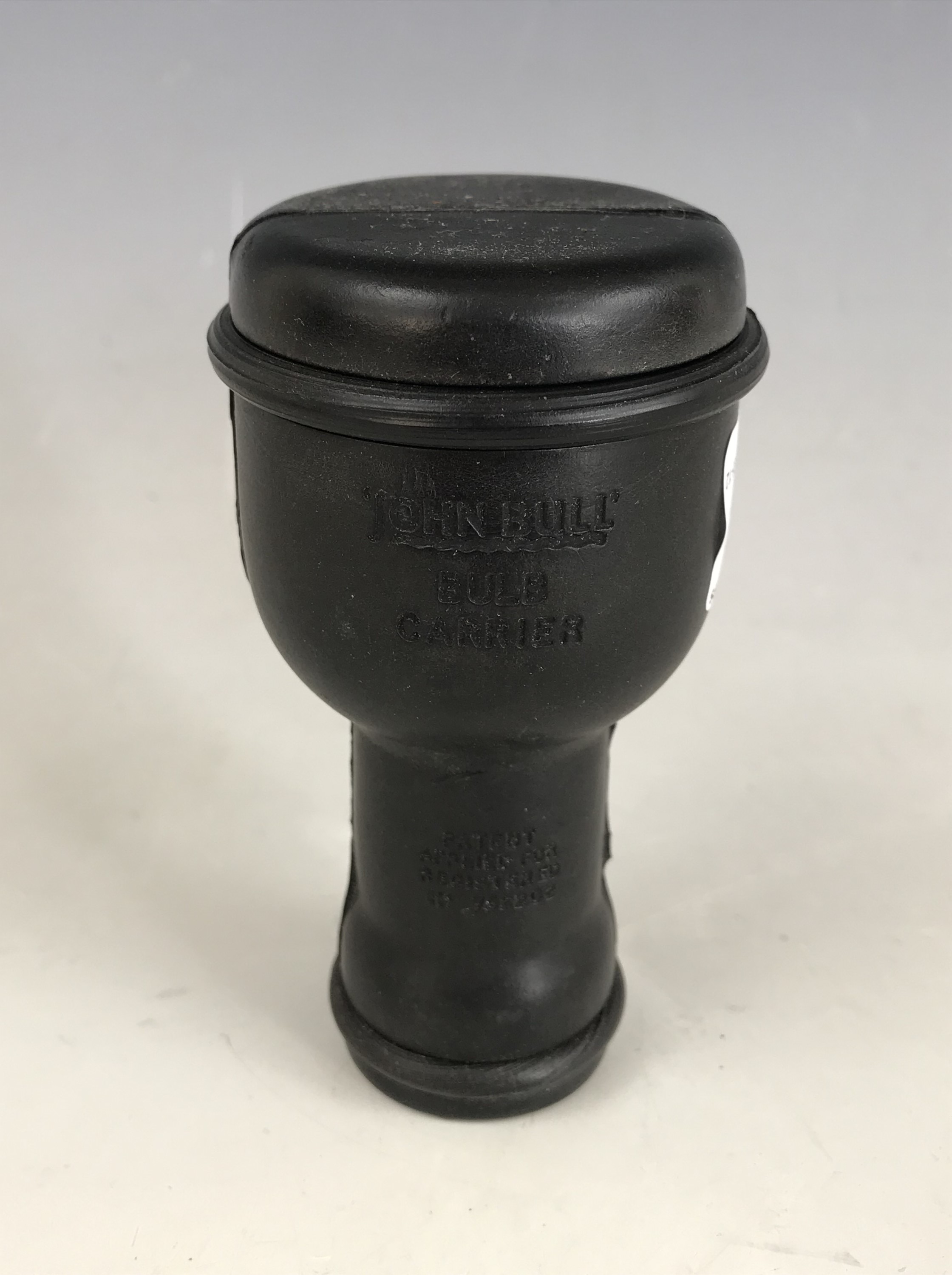 A vintage car electric light bulb holder, in moulded rubber, bearing patent details and "John Bull