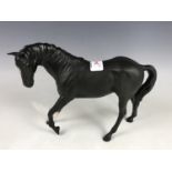 A Beswick matt black stallion