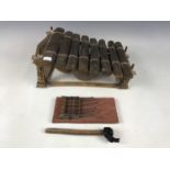 An African Kalimba / thumb harp together with a wooden xylophone