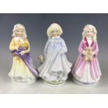 Three Royal Doulton figurines including Faith HN3082, Hope HN3061 and Charity HN3087