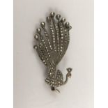 A vintage marcasite and white-metal brooch in the form of a peacock, stamped '800', 10.2g