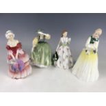 Four Royal Doulton figurines including Buttercup HN2309, Carolyn Copr 1952, Springtime HN3033 and