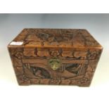 A Chinese carved camphorwood table casket with brass lock-plate and padlock, 30 cm wide