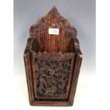 An antique Chinese carved wooden wall hanging box