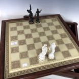 A bisque porcelain chess set, the pieces modelled as Classical gods, Zeus as King (14 cm), the pawns
