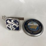 A vintage RAC car badge together with a Coastal Forces Veterans Association car badge