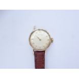 A lady's 1960s 9ct gold cased Longines wrist watch, having a brushed champagne dial and Arabic