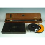 A cased W F Stanley & Co Ltd sliding rule, three Starrett micrometers and two reel tape measures