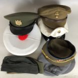 A quantity of post-War foreign military caps