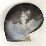 A late 19th / early 20th century carved mother of pearl dish depicting a fisherwoman