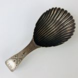 A Georgian silver caddy spoon, having a scalloped bowl, and wriggle-work and bright-cut engraved
