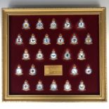 A limited edition framed group of enamelled silver-gilt (bearing assay marks) RAF squadron badges