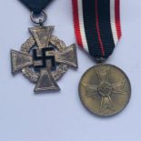 A German Third Reich Faithful Service Cross together with a War Merit Medal