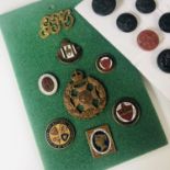 A collection of badges, buttons and brooches pertaining to the Royal Mail and General Post Office