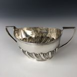 A silver sugar bowl, of Georgian shape, decorated with gadrooning, C S Harris and Son Ltd, London,