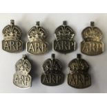 7 ARP silver lapel / hat badges and one electroplate example