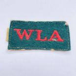 A Women's Land Army slip-on shoulder title