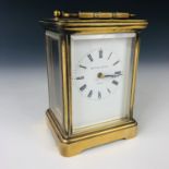 A 20th century Matthew Norman of London brass cased carriage clock, having a white-enamelled dial,