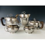 A George V Scottish Arts and Crafts silver five-piece tea and coffee service by Sybil Norah Pringle,