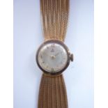 A mid-20th Century lady's yellow-metal cased Ebel wrist watch, having a silvered face and baton