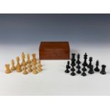 An early 20th century ebony and boxwood Jaques type Staunton chess set, in wooden box