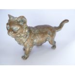 Attributed to Franz Bergman, a cast brass cat, modelled in an alert upright stance with raised tail,