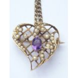 An antique amethyst and pearl openwork pendant brooch in the shape of a heart, the oval-cut