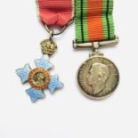 A miniature OBE and Defence Medal