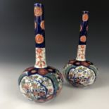 A pair of Meiji Japanese Imari bottle vases, 22 cm