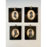 Four 19th century silhouettes of gentlemen, including a painted example entitled 'John Norman,