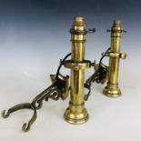 A pair of Victorian brass wall mounting and gimbled marine or railway lamps, period-converted to