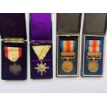 Four cased Imperial Japanese medals