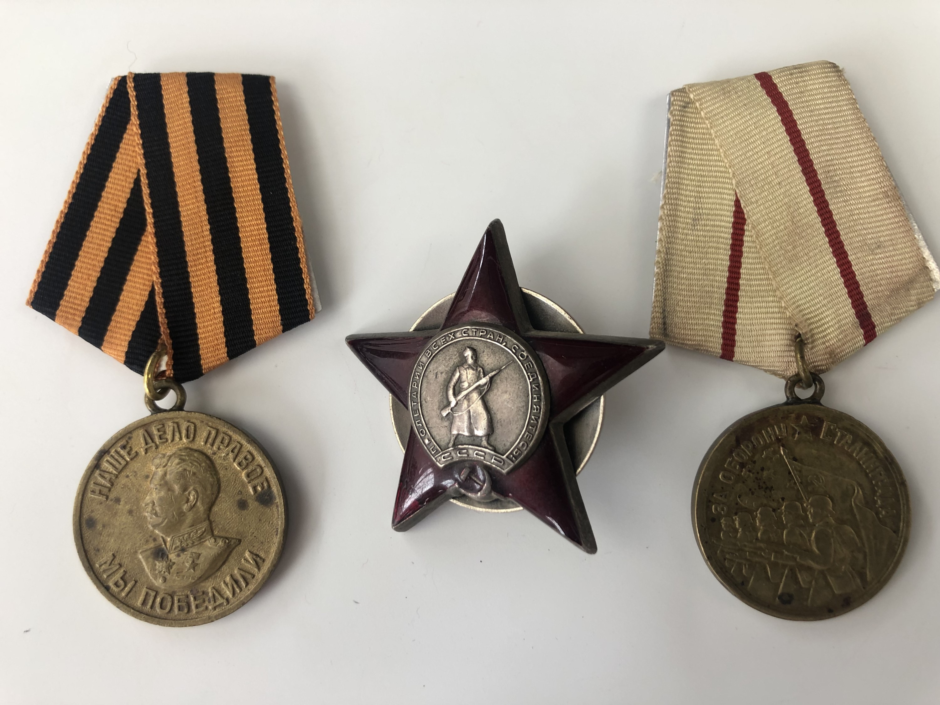 A Soviet Order of the Red Star together with medals for the Defence of Stalingrad and Victory over