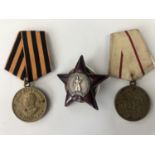 A Soviet Order of the Red Star together with medals for the Defence of Stalingrad and Victory over