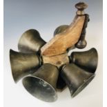 An early 19th Century set of rotary bells by Robert Wells of Aldbourne, 26 cm diameter