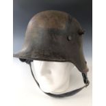 An Imperial German stahlhelm / helmet bearing officially designated painted camouflage