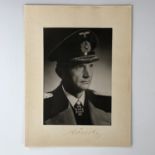 [Autographs] A photographic portrait of Admiral Karl Dönitz, in period card mount, the latter